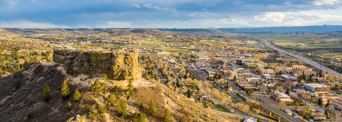 The rock formation from which the Town of Castle Rock derives its name in front of the community's homes and businesses.